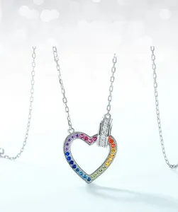 Close-up of S925 sterling silver heart necklace with gradient rainbow cubic zirconia