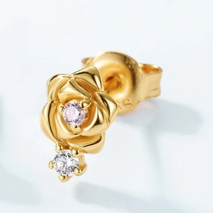 Macro shot of S925 silver rose stud earring with pink garnet and sparkling zircon detail
