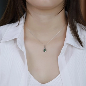 Elegant S925 sterling silver necklace with a green moss water drop pendant and diamonds
