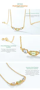Macro detail of emerald-cut peridot and blue topaz stones on a gold-plated silver chain