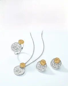 Detailed flat lay of Victorian style coin jewelry set including necklace, ring, and earrings