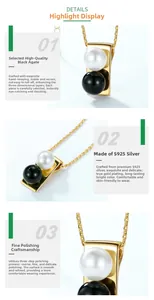 Detail of S925 silver necklace with white pearl and black onyx on golden frame