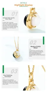 Detailed close-up of double-sided S925 gold-plated necklace with black onyx and white shell