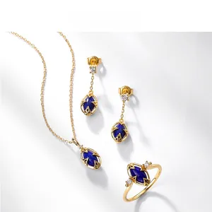 Detailed macro view of S925 silver gold-plated ring set with lapis lazuli and white crystals