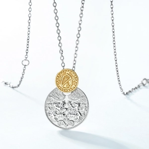 Detailed macro view of S925 sterling silver coin pendant with ornate heraldic lion engraving