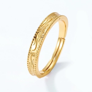 Macro shot of 925 silver gold-plated ring with intricate vintage filigree floral patterns