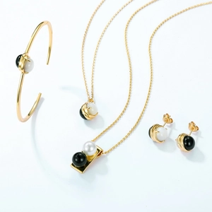 Modern gold-plated 925 silver jewelry set with black agate and white shell beads