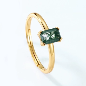 Macro detail of adjustable gold ring with rectangular green moss agate gemstone inlay