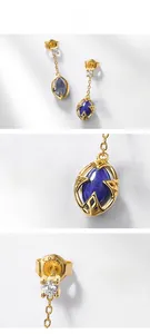 Close-up of S925 sterling silver hallmark on teardrop lapis and crystal earring