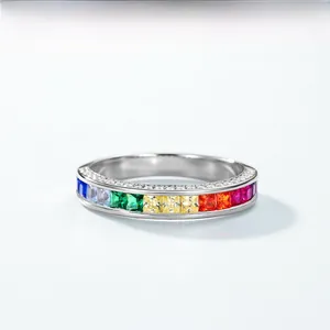 Close-up of 925 silver ring featuring rainbow gradient gemstones and side pavé diamonds