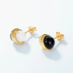 Detailed view of S925 sterling silver studs with black and white agate gemstones