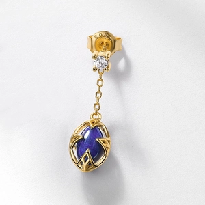 Macro detail of S925 hallmark on gold drop earrings with blue lapis and white crystal