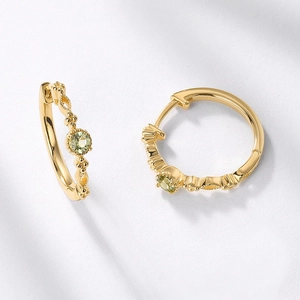 Retro S925 silver huggie earrings with gold plating and green peridot gemstones
