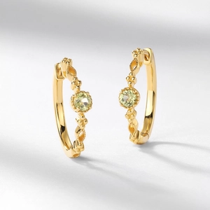 Retro S925 silver earrings with olive green gemstone and vintage hollow pattern