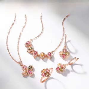 Detail of S925 silver necklace set with colorful pear-cut gems in four-leaf clover design