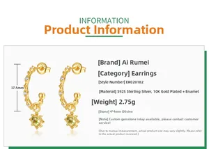 Detail view of S925 sterling silver gold earrings with peridot and starburst pendants