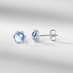 Boucles d'oreilles fleur minimalistes en argent S925 avec topaze bleue et plaqué or