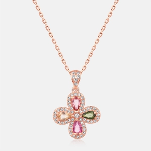Detail of rose gold clover pendant with colorful tourmaline gemstones and pavé crystals
