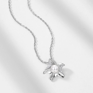 Élégant collier en argent S925 avec pendentif étoile de mer serti d'une perle blanche