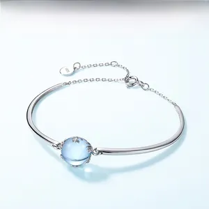 Detail of S925 sterling silver bracelet with sky blue topaz bead and lobster clasp