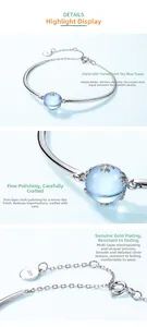 Detailed views of S925 silver bracelet featuring sky blue topaz and polished gold plating