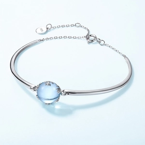 Minimalist S925 sterling silver bangle featuring a sphere sky blue topaz stone pendant
