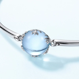 Minimalist S925 sterling silver bangle with a large round sky blue topaz gemstone