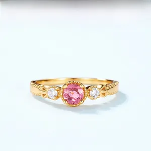 Detail of pink tourmaline ring in 18K gold plated silver with side diamond accents
