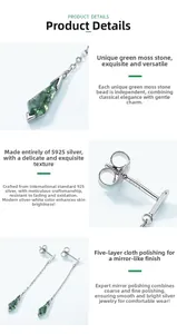 Macro detail of kite-cut moss agate earrings featuring S925 sterling silver hallmarks