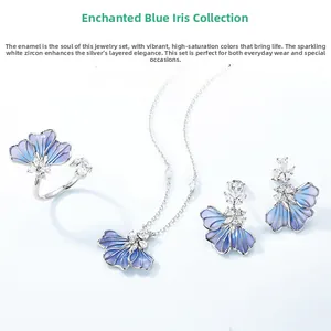 Detailed shot of gradient blue enamel iris jewelry set with silver and white zircon