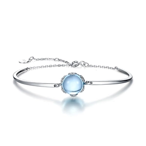Elegant S925 sterling silver bangle featuring a sky blue topaz and adjustable chain