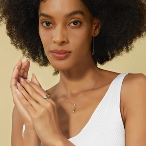 Exquisite S925 silver jewelry set with marquise green moss gemstones on a model