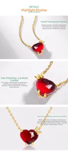 Detailed view of S925 silver heart necklace with garnet stone and gold plating