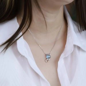 S925 sterling silver necklace featuring a cat pendant with a light blue topaz gemstone