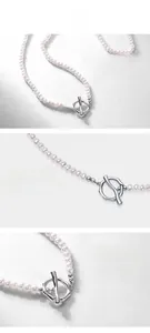 Macro detail of natural freshwater pearl necklace featuring silver OT toggle clasp