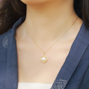 Elegant gold S925 silver necklace featuring a white shell pearl pendant with halo stones