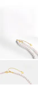 Détail du pendentif cœur en argent S925 et du fermoir doré sur collier de perles fines