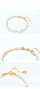 Detail view of S925 sterling silver heart charm and seed pearls with real gold plating