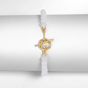 S925 silver gold-plated bamboo bracelet with white jade beads on a display stand