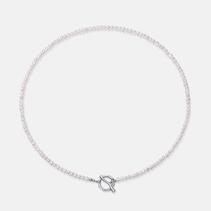 Macro detail of natural pink freshwater pearl necklace with silver-tone toggle clasp