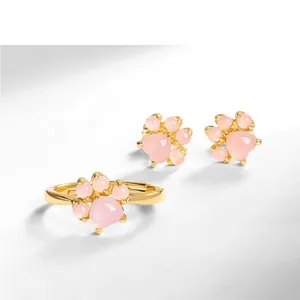 Detail shot of a sweet cat paw jewelry set with rose quartz in S925 10K gold plating