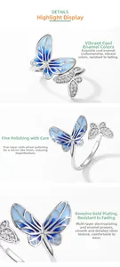 Detail of S925 silver double butterfly ring with blue enamel and mirror finish