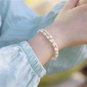 Double-layer S925 silver plated gold freshwater pearl bracelet worn by a model