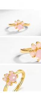 Macro detail of cat claw ring with pink quartz stones and 10K gold plated silver band
