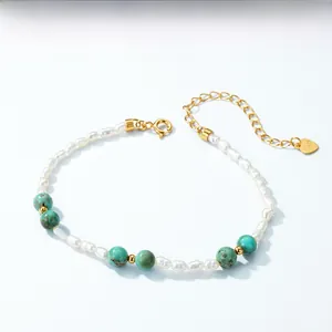 Detailed close-up of S925 sterling silver heart tag with natural turquoise and pearls