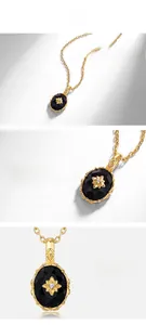 Détail macro du pendentif agate noire ovale avec fleur dorée et collier en argent S925