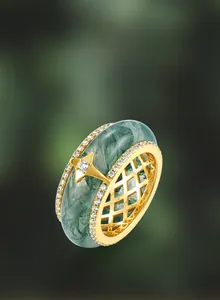 Close-up of S925 silver moss agate ring with golden star and cubic zirconia details