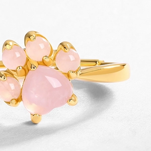 Macro detail of cat paw ring featuring pink quartz stones in a 10K gold-plated setting