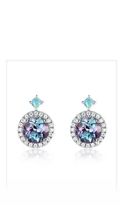 Macro detail of S925 silver stud earrings with alexandrite and round opal accents
