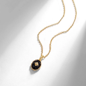 Collier vintage avec pendentif onyx noir ovale en argent S925 plaqué or et détail fleur
